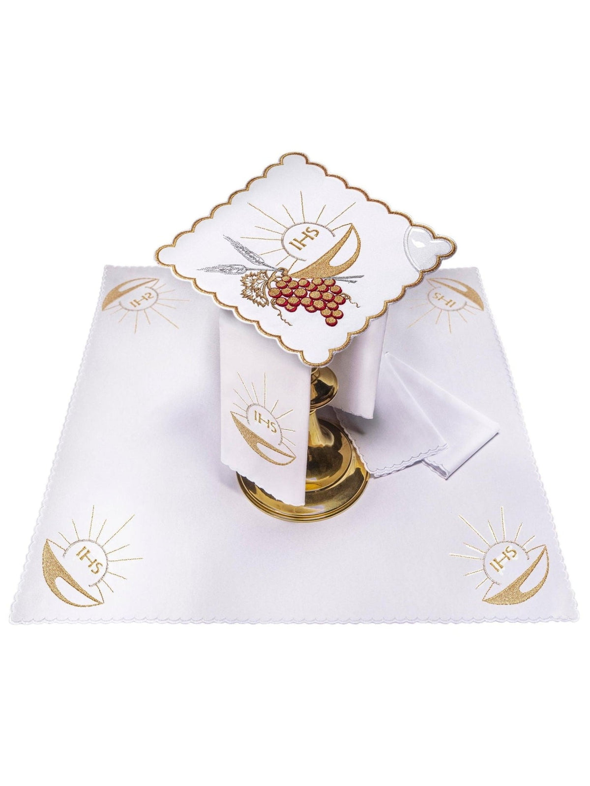 Altar linen set displayed with embroidered gold chalice motifs on white linens