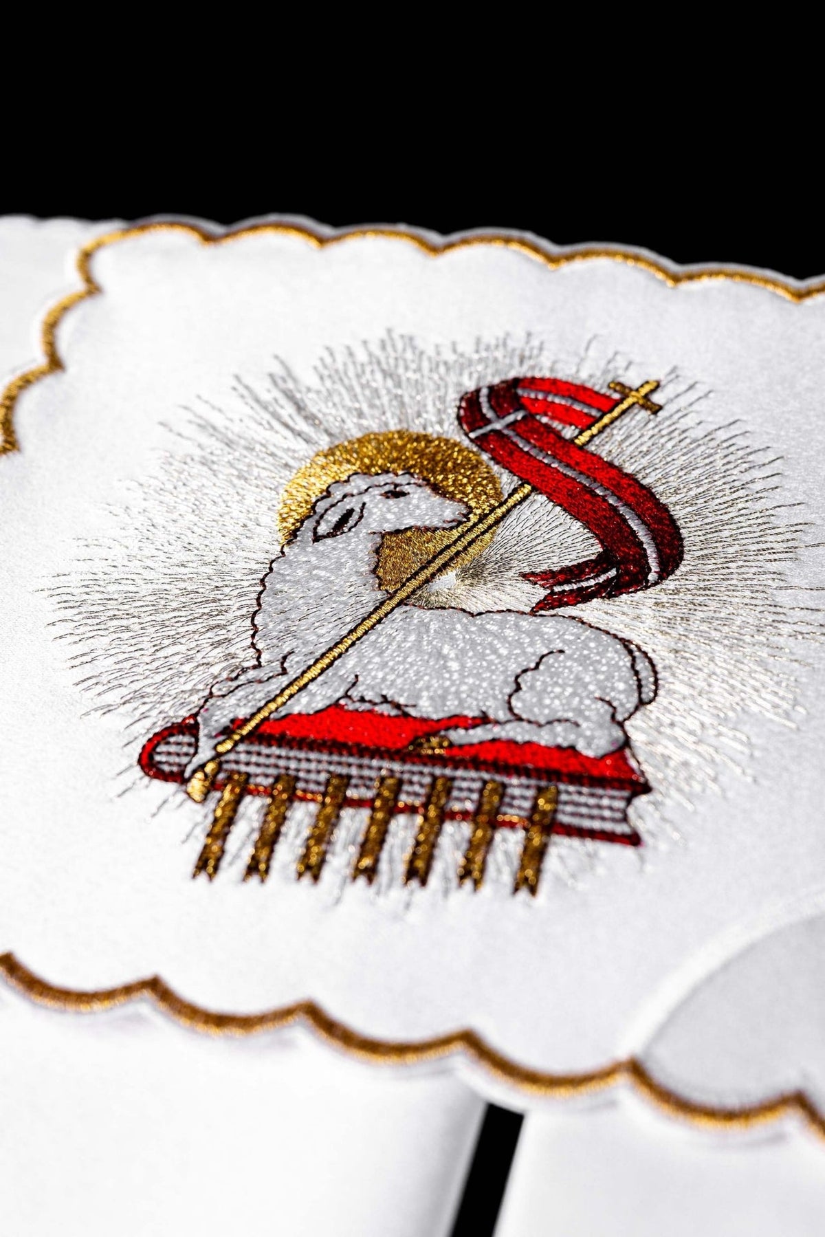 Agnus Dei altar linen close-up with embroidered lamb, red banner, gold halo and scalloped gold trim