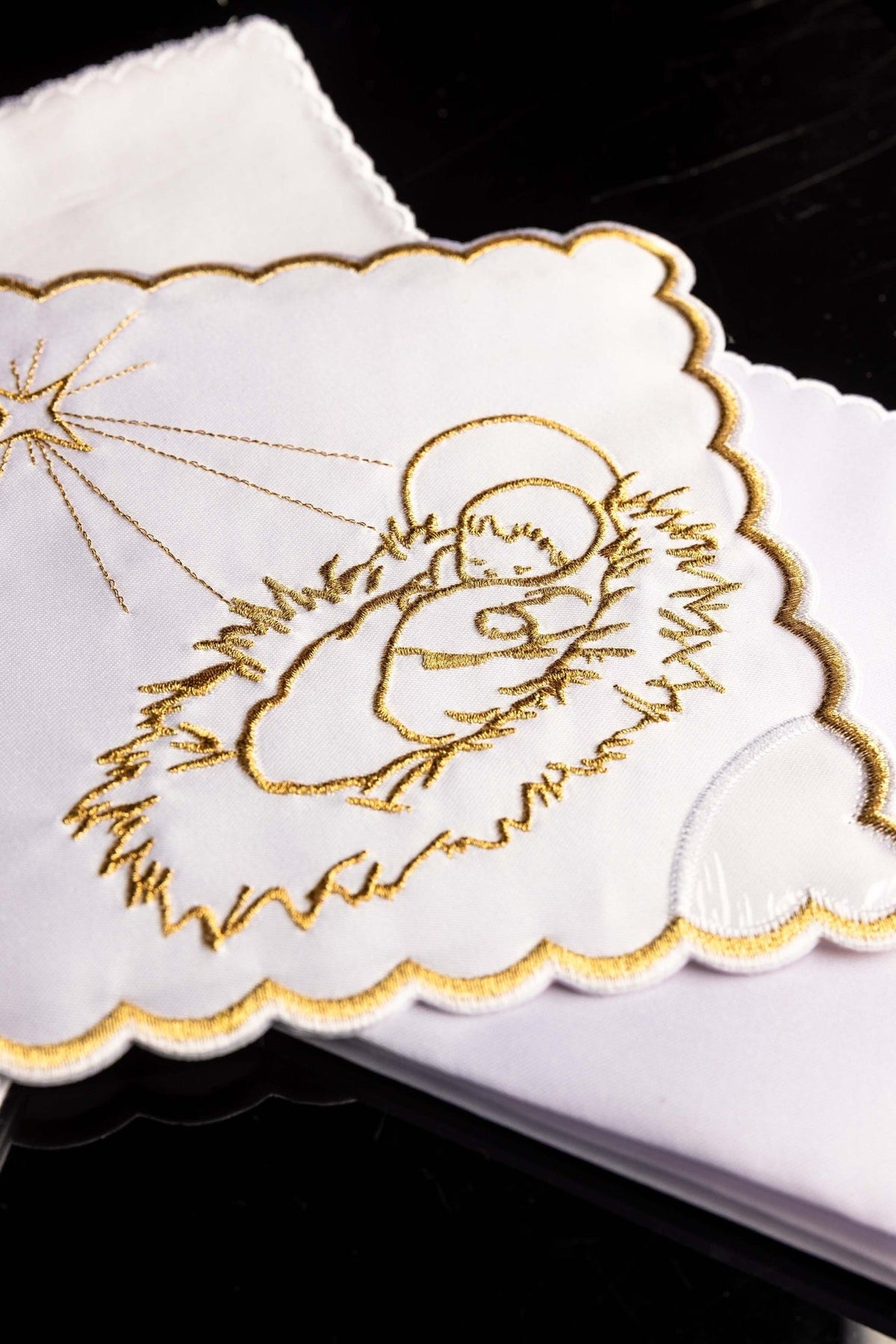 Christmas altar linen set close-up with embroidered Holy Family and star motif