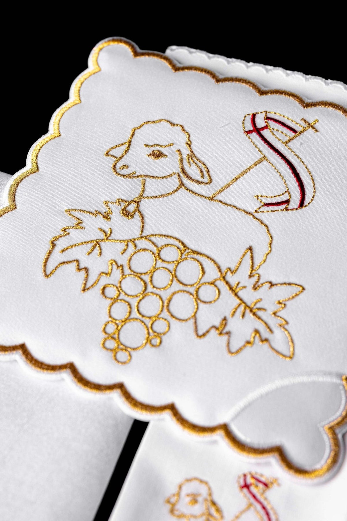Altar linen set close-up showing embroidered Paschal Lamb with grapes and red staff