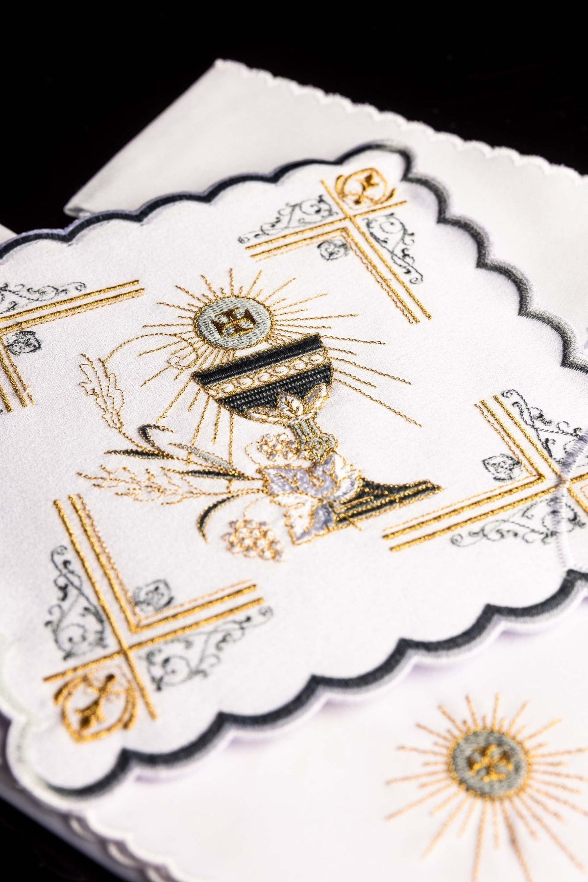 Altar linen set close-up showing embroidered gold and silver chalice, grapes, wheat and ornate corner motifs