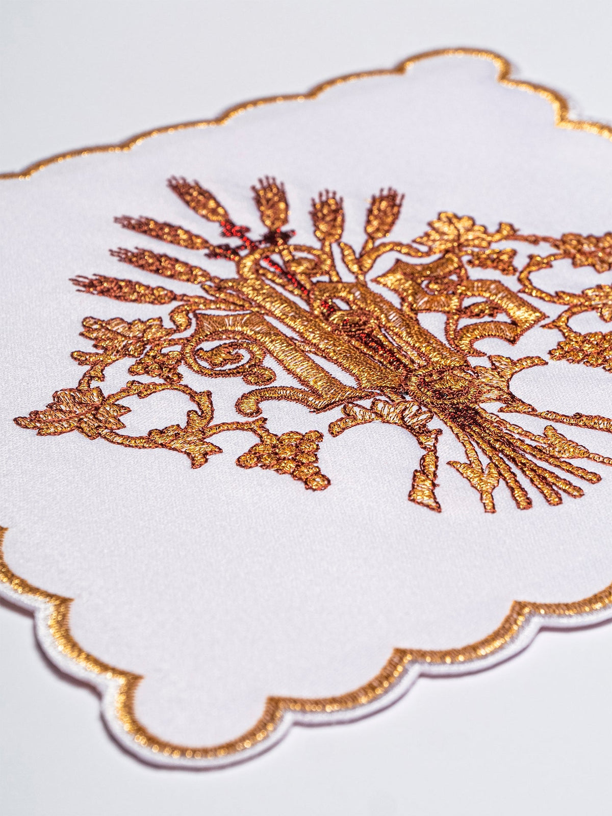 Altar linen set close-up showing gold IHS and wheat embroidery
