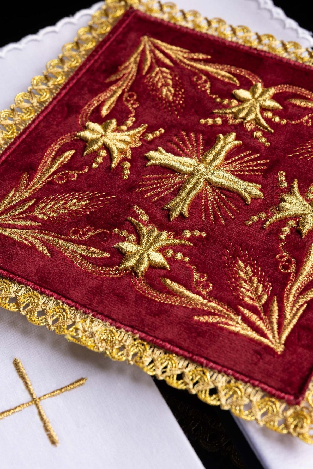 Altar linen set close-up showing red velvet, gold embroidery and ornate gold trim