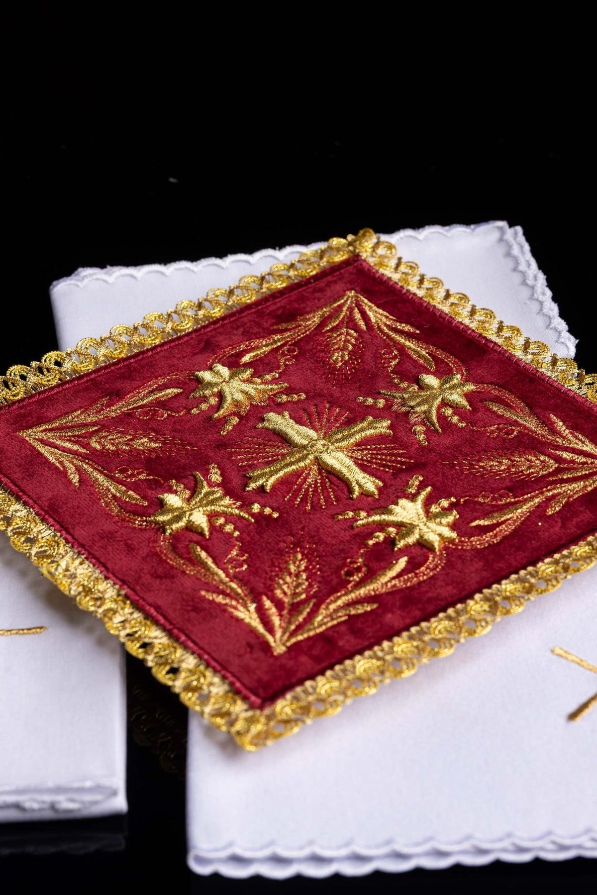 White altar linen set detail with scalloped edge and gold cross embroidery