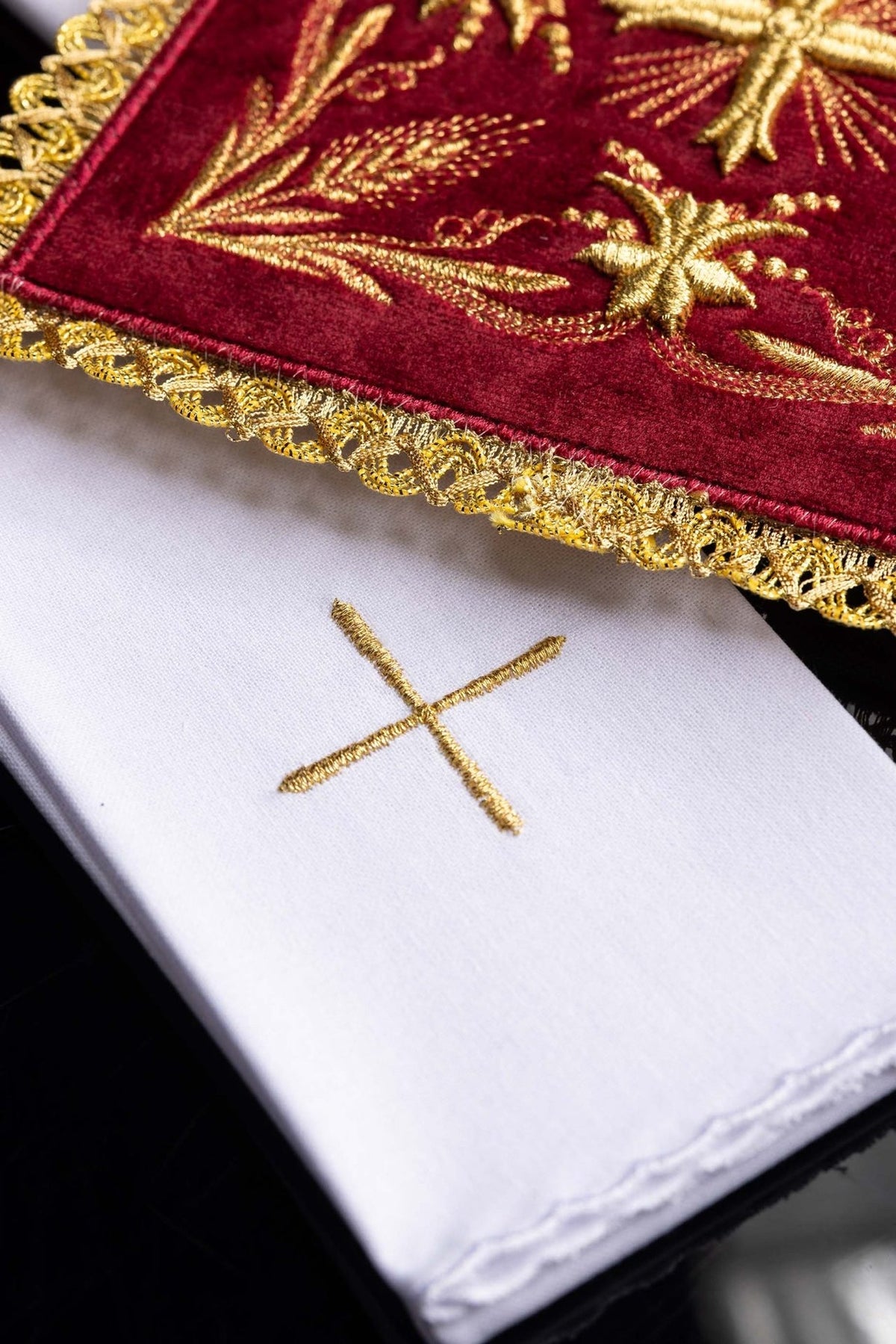 Altar linen set front view showing red velvet panel with central gold cross and floral embroidery