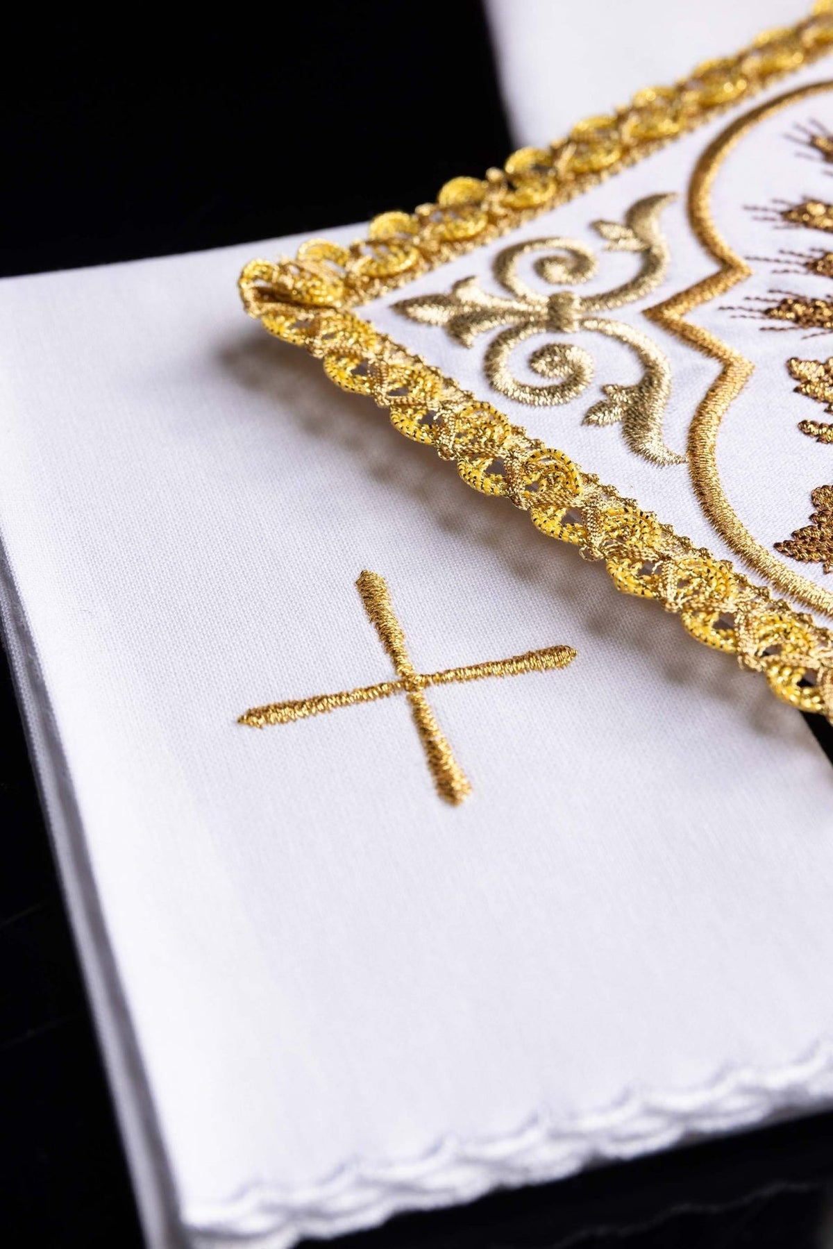 Altar linen set side detail showing raised gold border embroidery and cross
