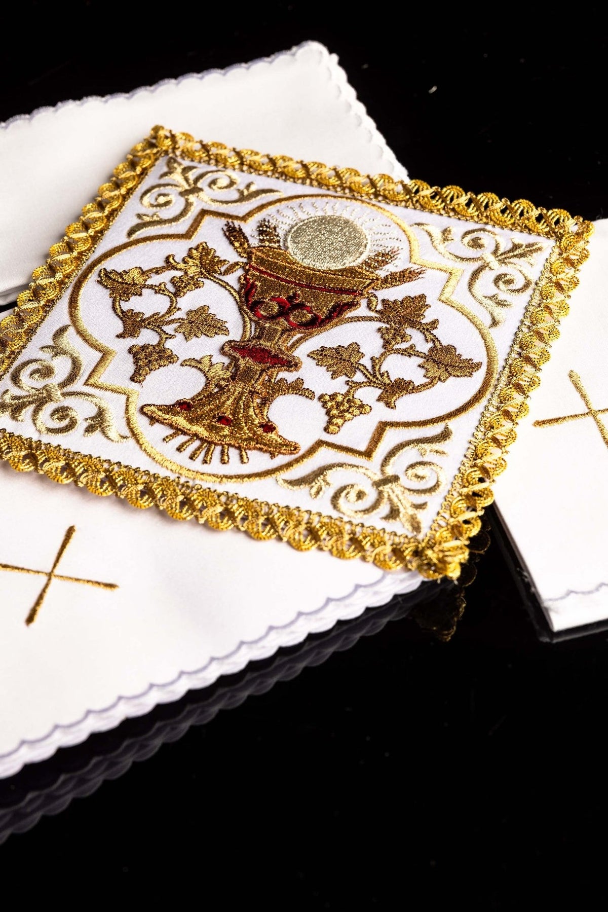 Altar linen set close-up of communion chalice embroidery with ornate gold border