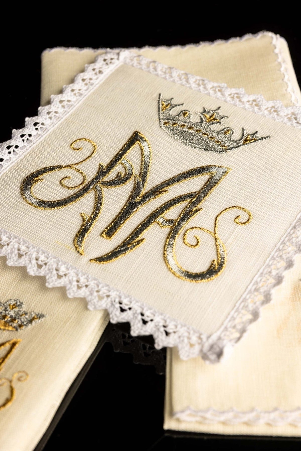 Altar linen set close-up showing Our Lady Marian symbol embroidery and lace edging