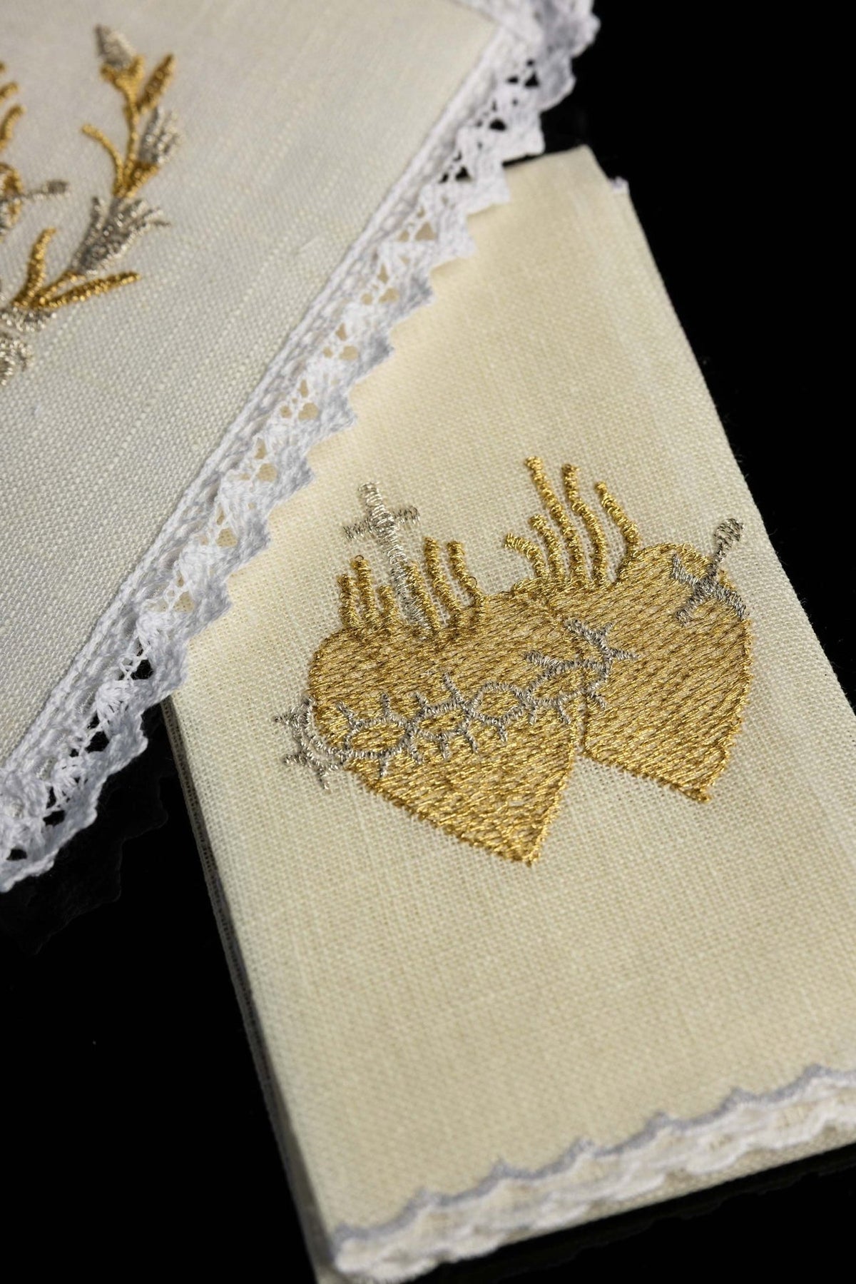Altar linen set detail showing gold and silver Sacred Heart embroidery on ivory linen