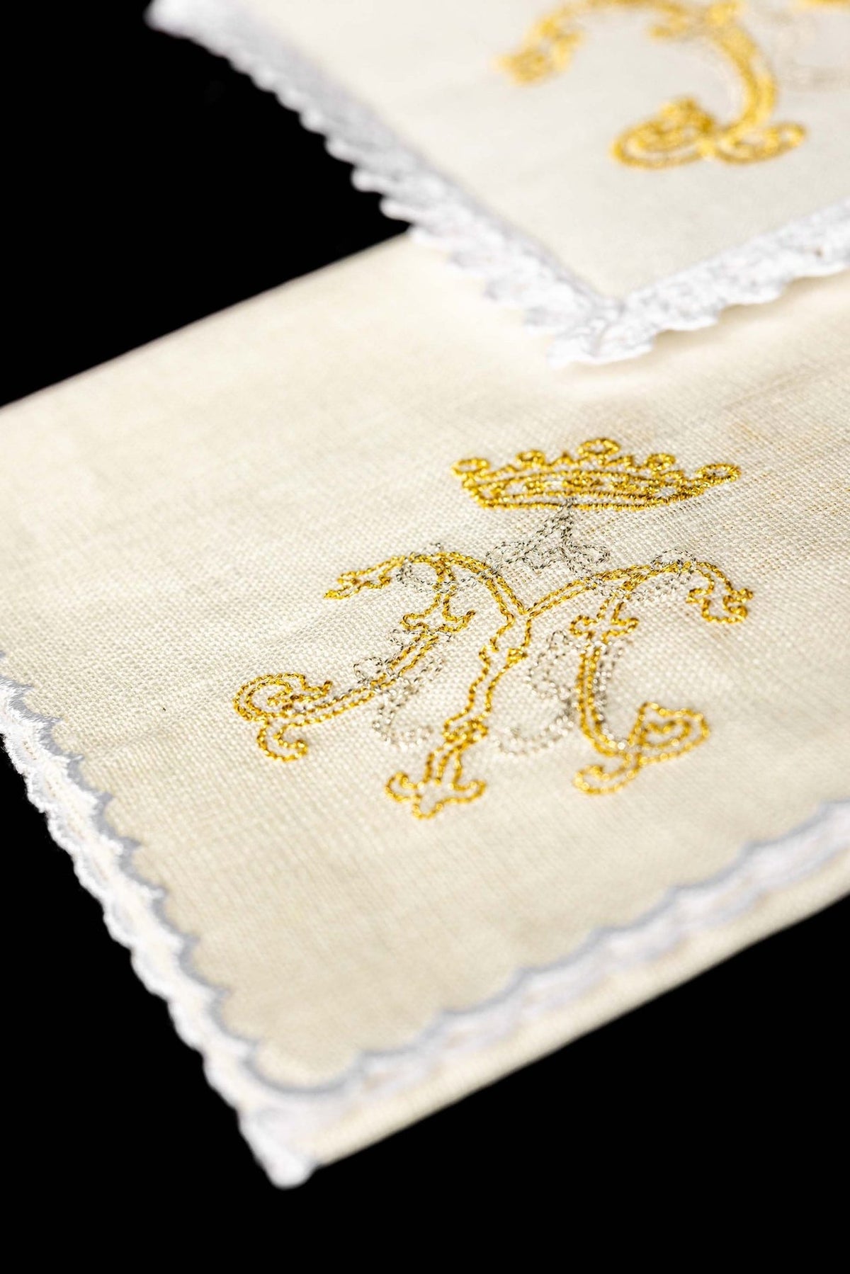 Altar linen set folded view showing gold Marian embroidery on linen
