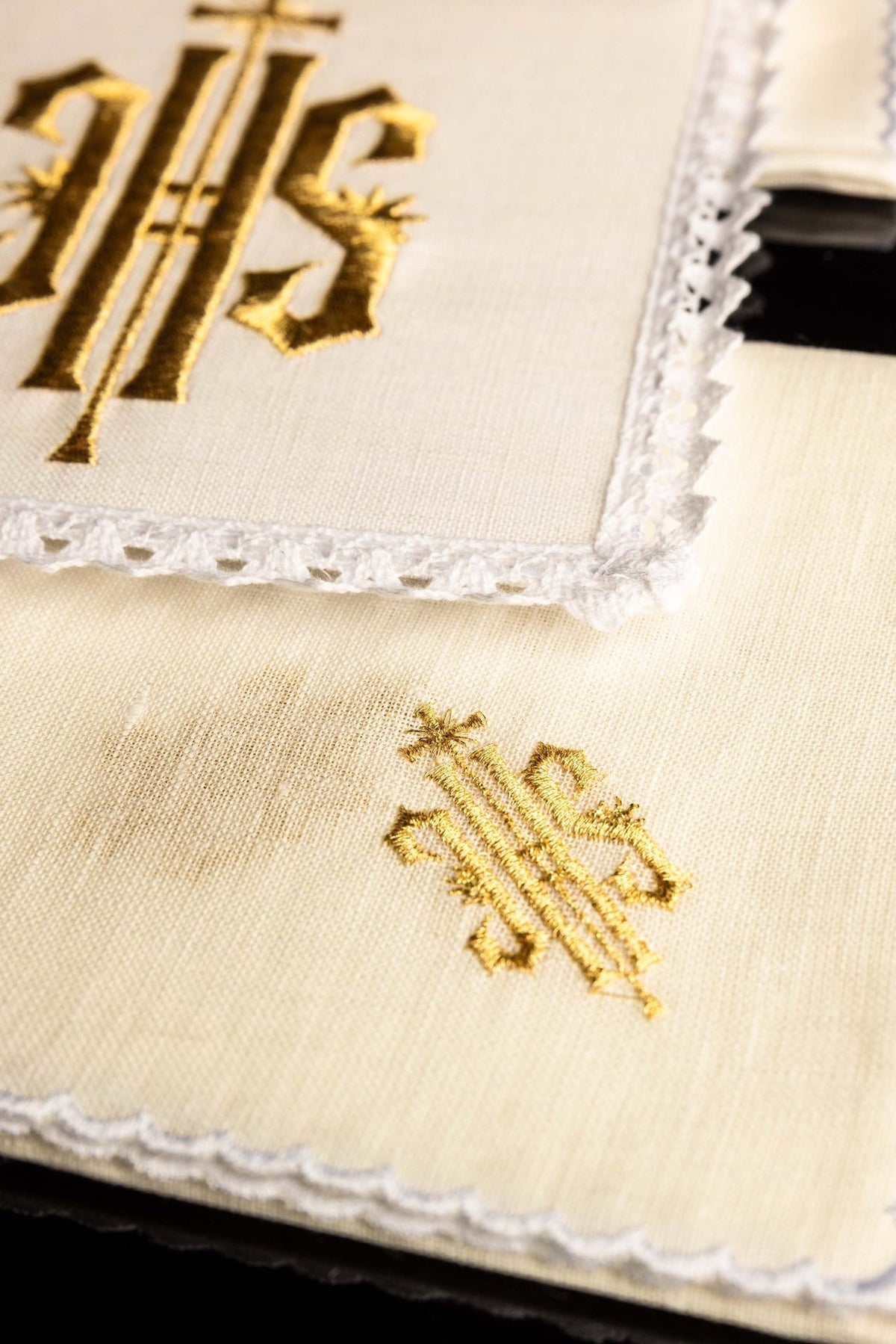 Altar linen set detail showing gold IHS embroidery on white linen