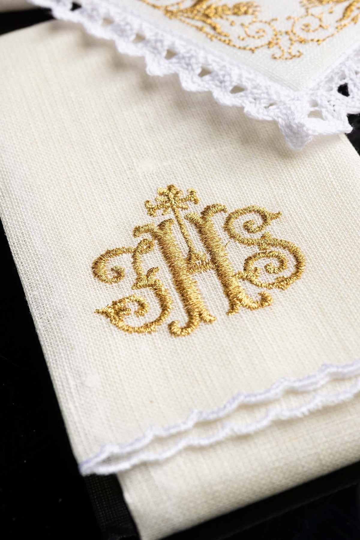 Altar linen set detail showing gold IHS embroidery and floral border