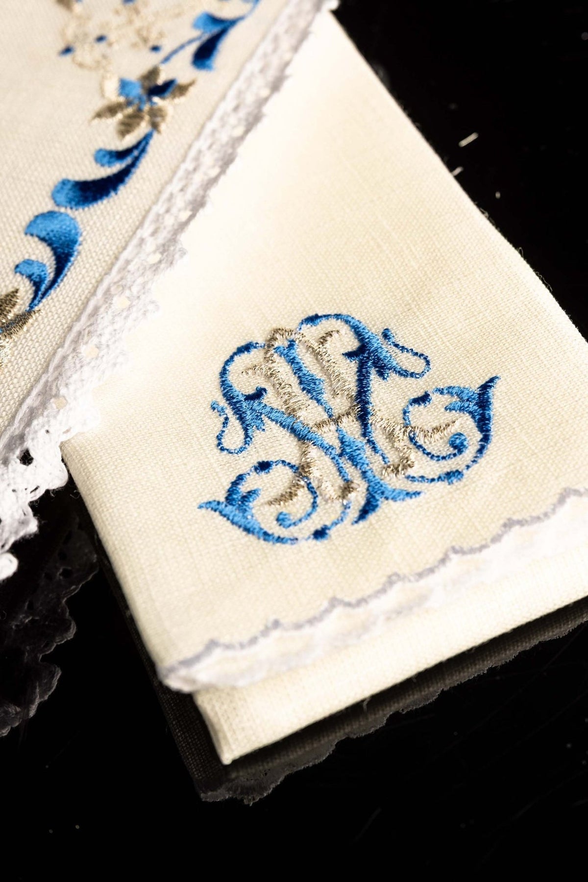 Altar linen set detail showing blue and gold Marian symbol on linen
