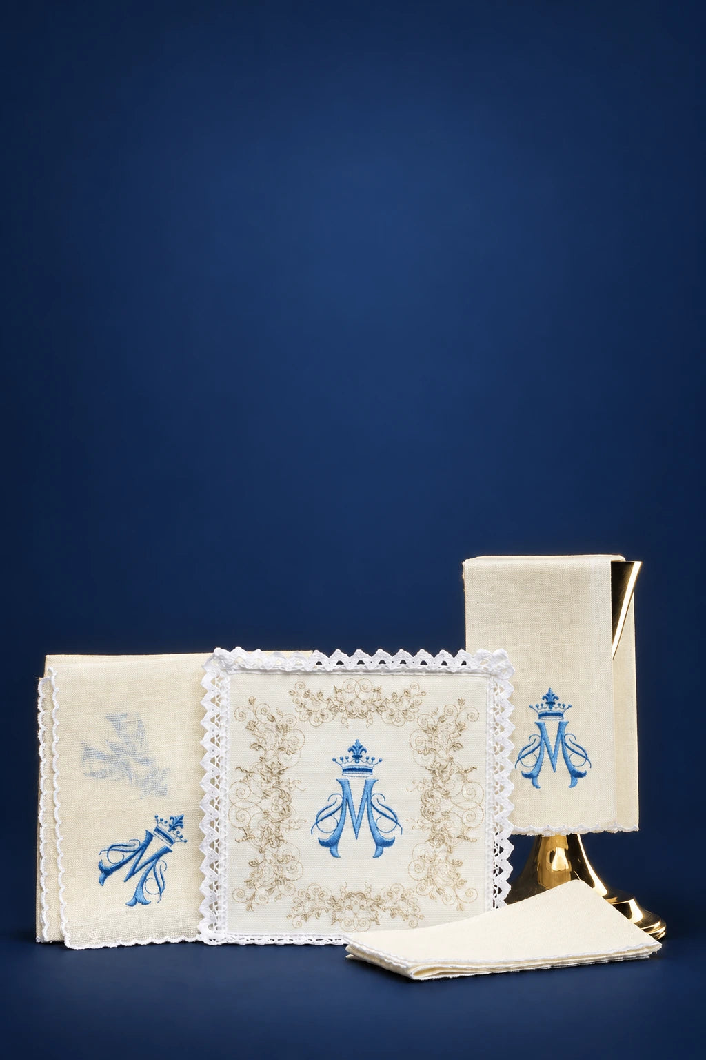 Embroidered Altar Linen Set in Linen with Marian Symbol, front view with cream linens, blue Marian symbols and lace trim