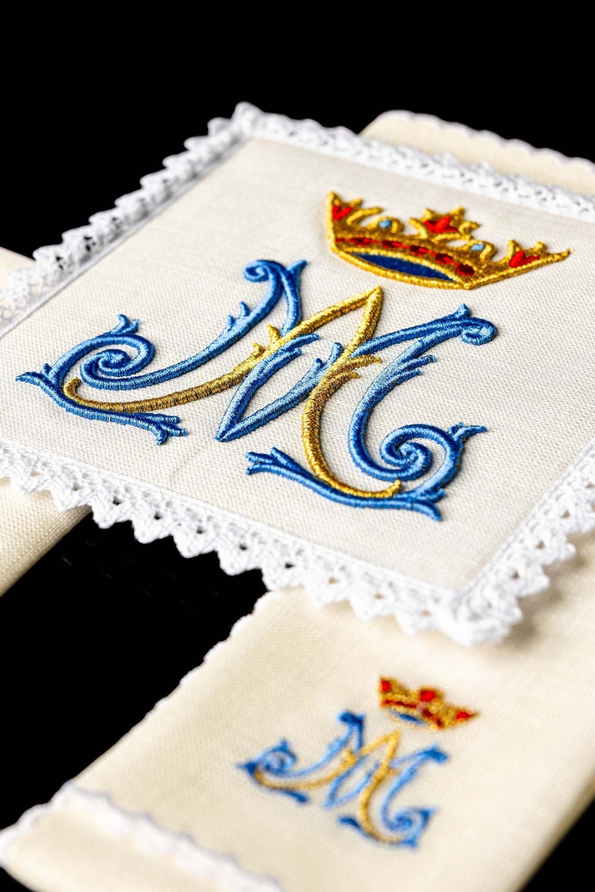 Altar linen set close-up of blue and gold embroidery and white lace trim