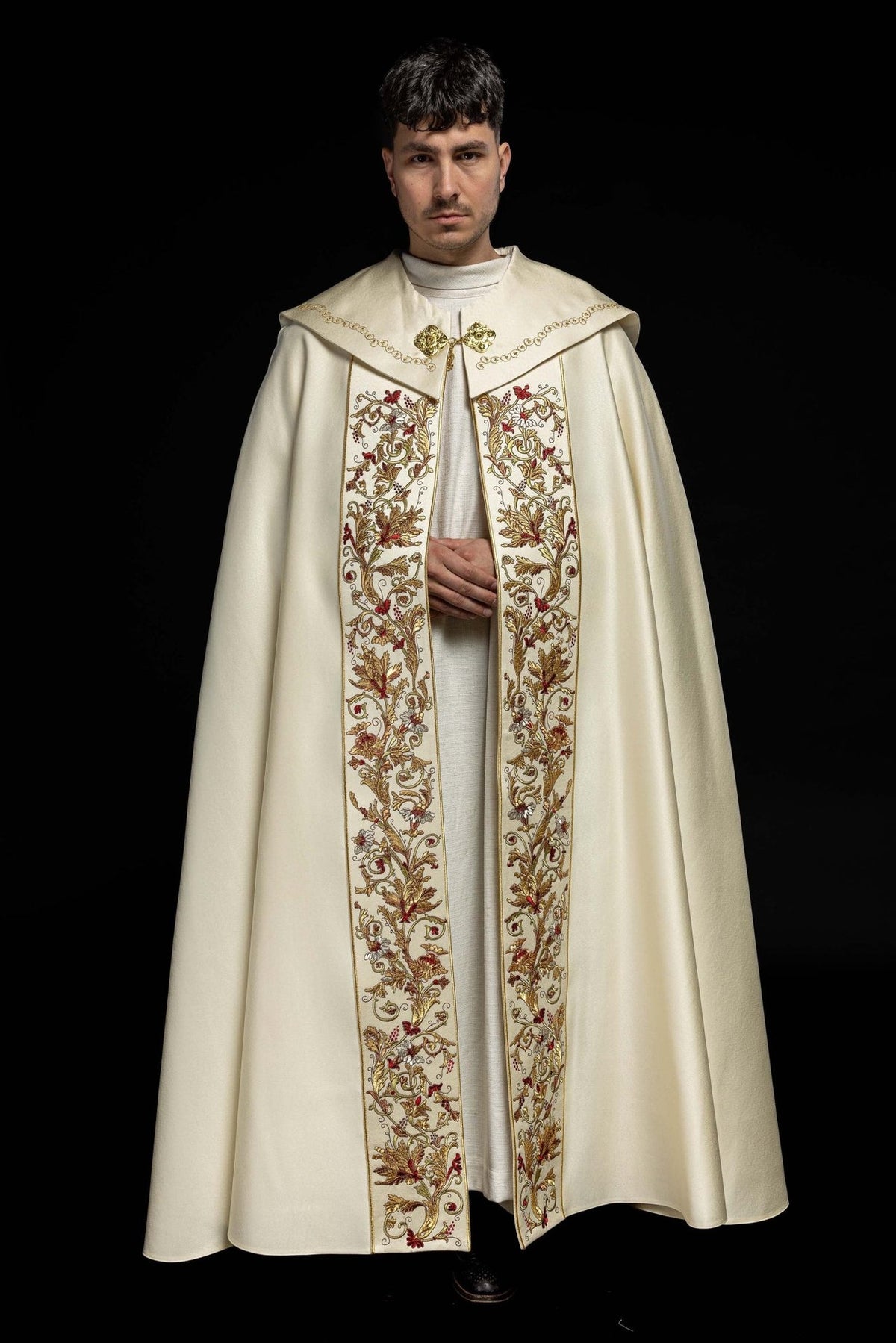 Ecru satin cope, worn front view with embroidered floral panels