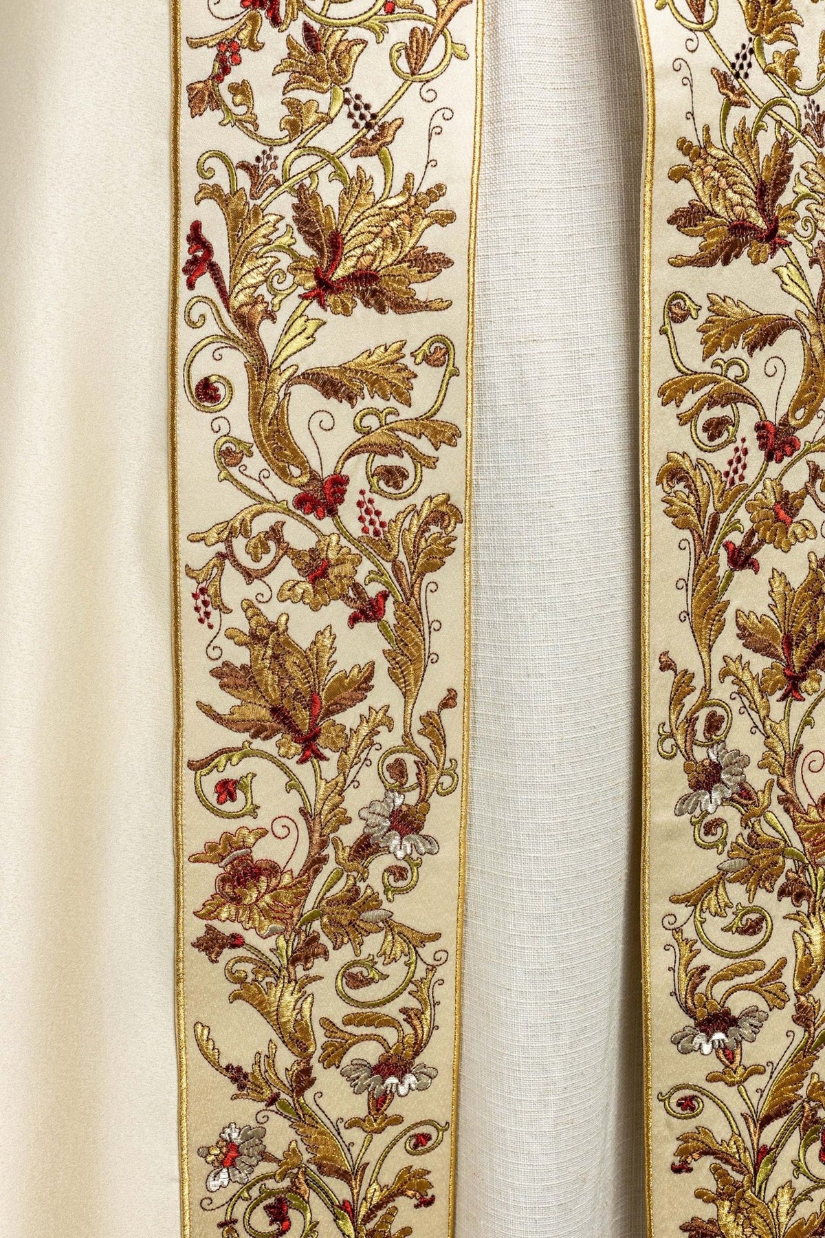 Ecru satin cope, close-up of multicolour floral embroidery on front panel