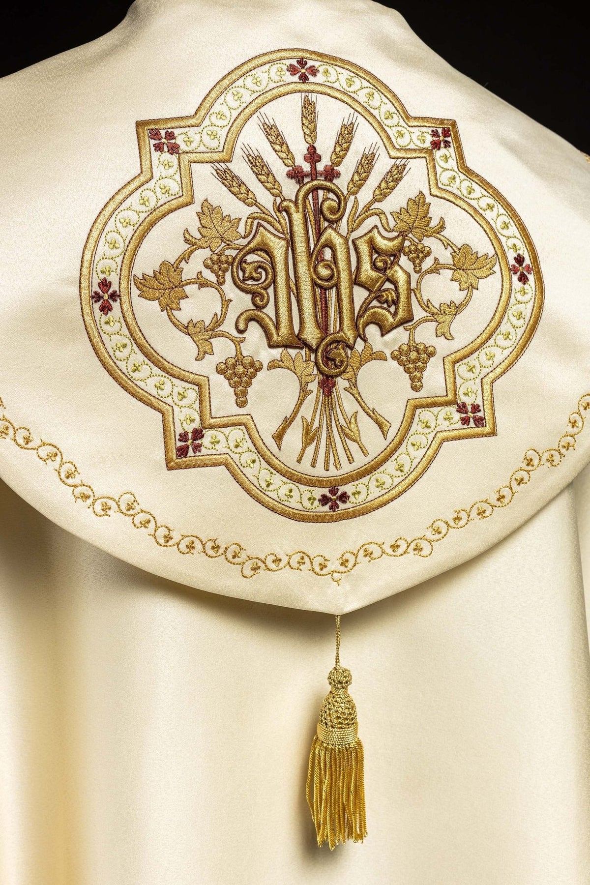 Ecru satin cope, back close-up of raised gold IHS embroidery