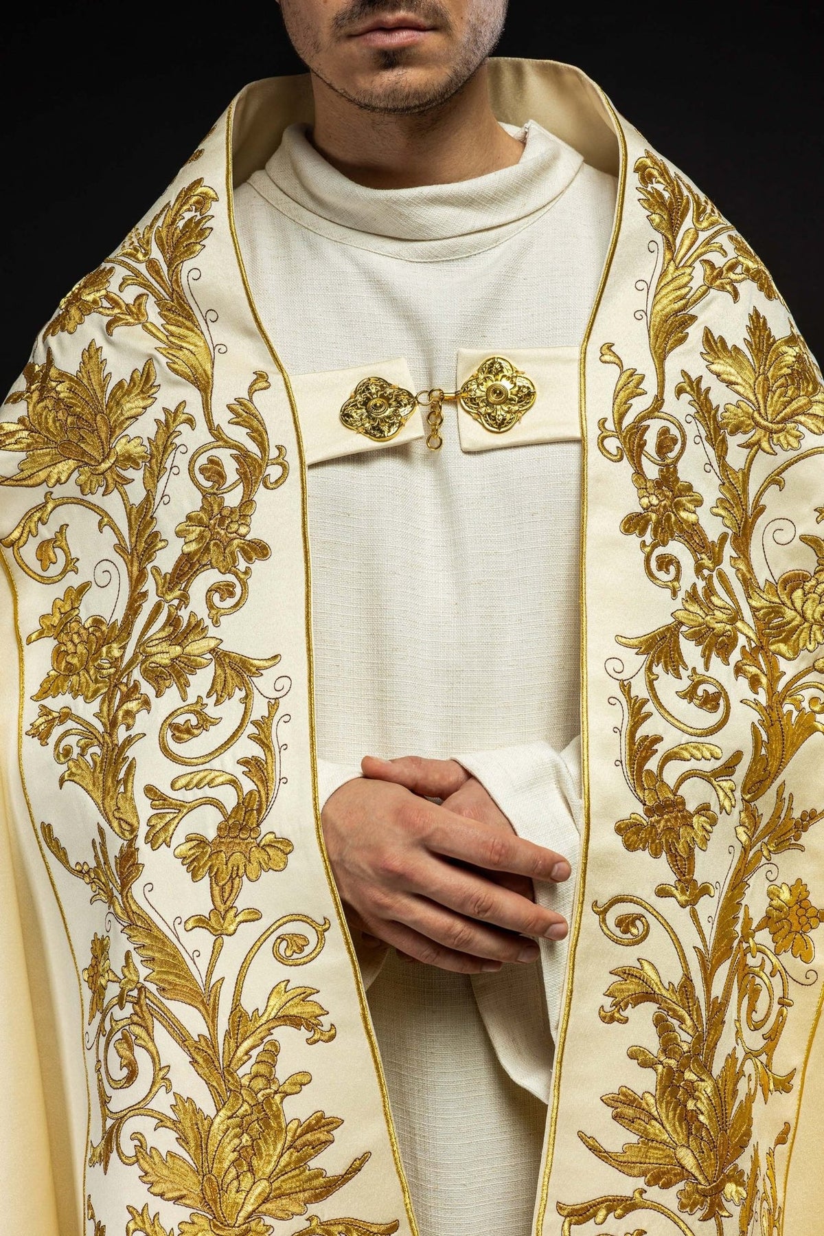 Ecru satin cope, front close-up with floral embroidery and decorative clasp