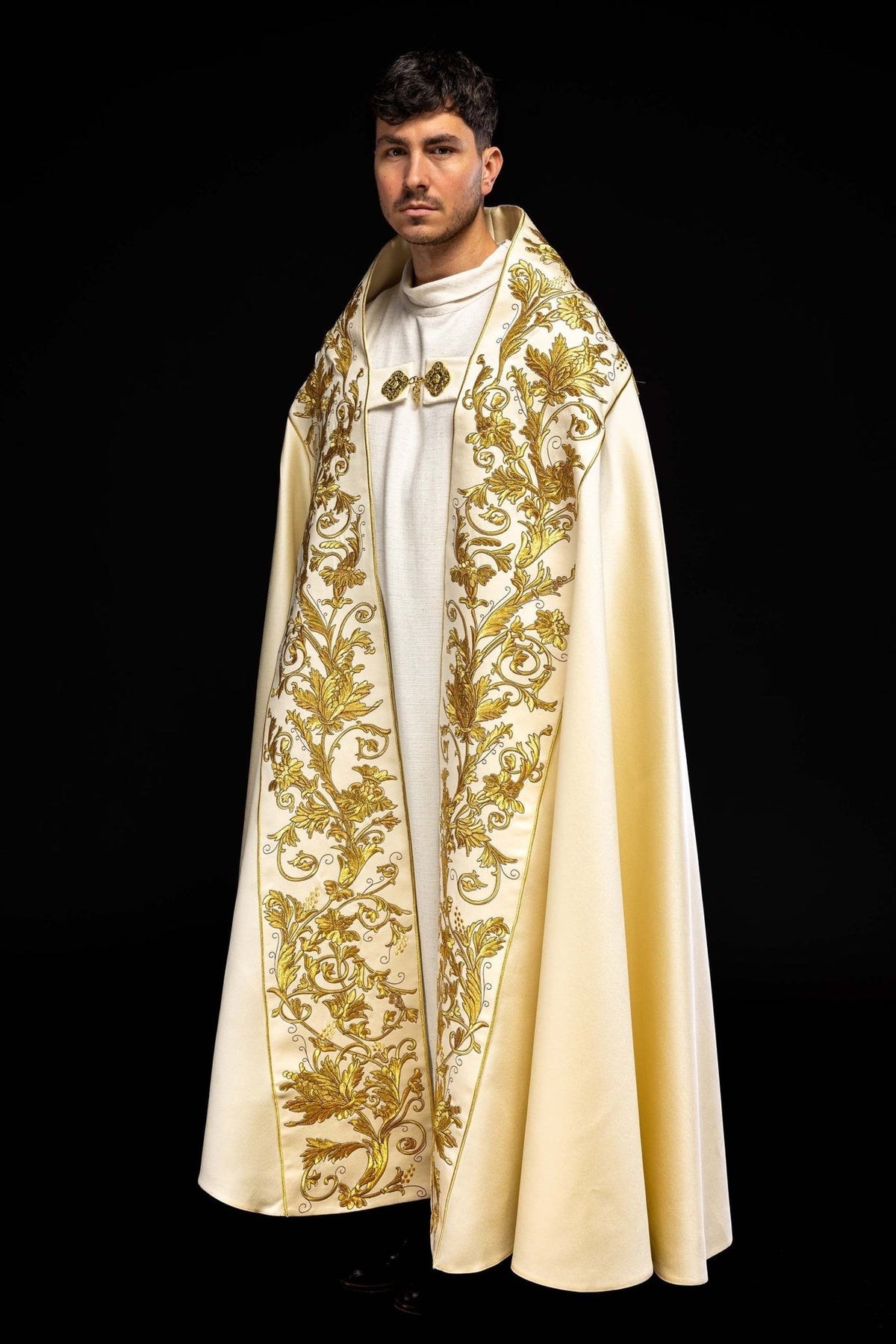 Ecru satin cope, three-quarter front view with extensive gold floral embroidery