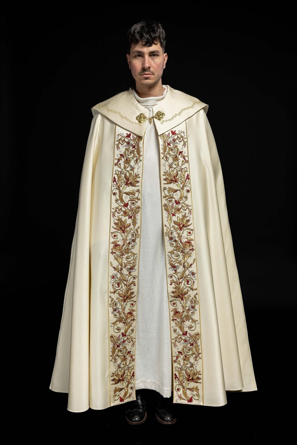 Ecru cope front view with ornate floral embroidery on two vertical panels