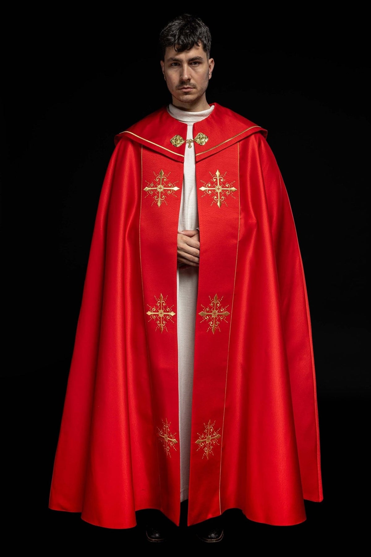Red cope front view with four gold cross embroidery motifs and gold trim