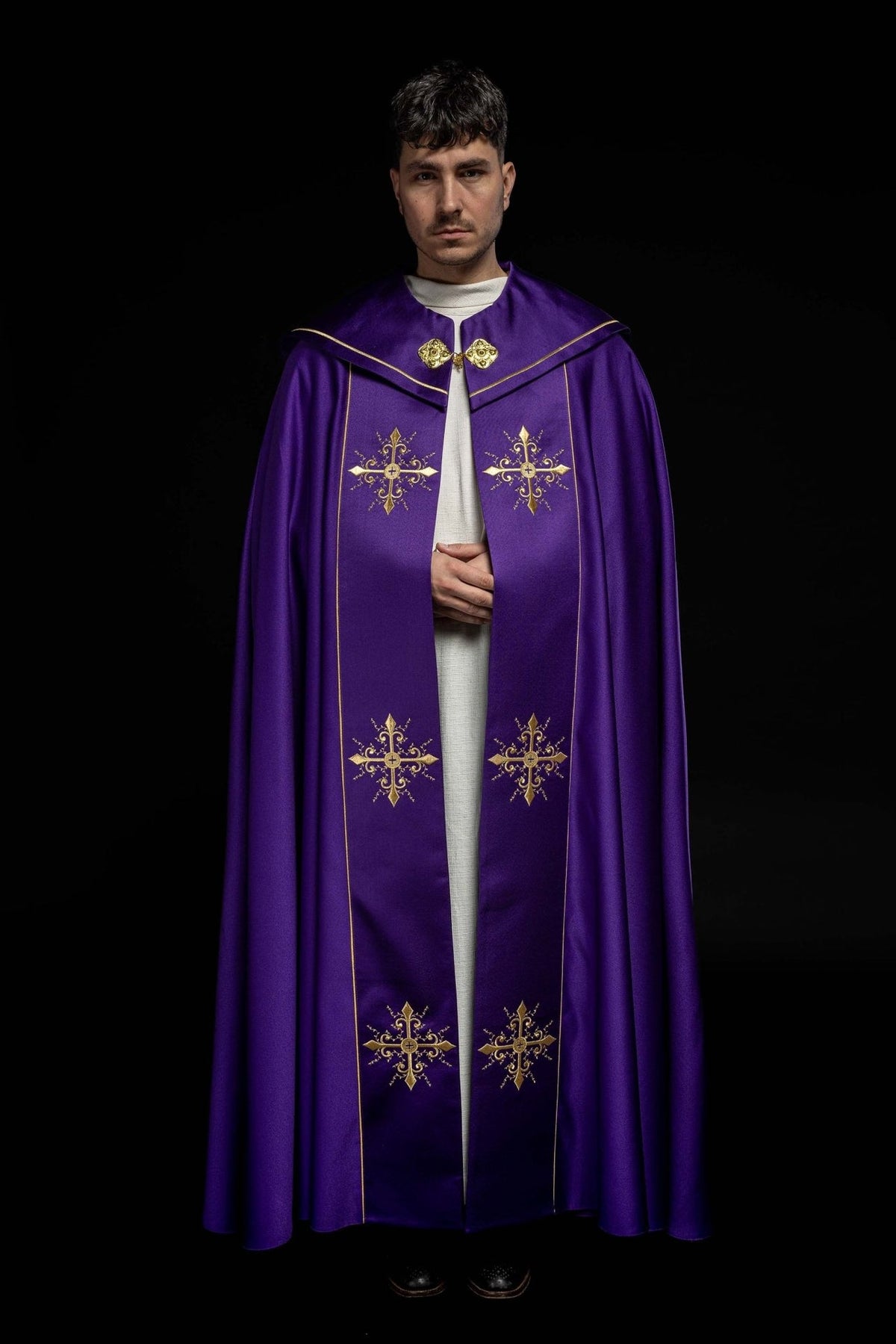 Purple cope front view with four gold cross embroidery motifs