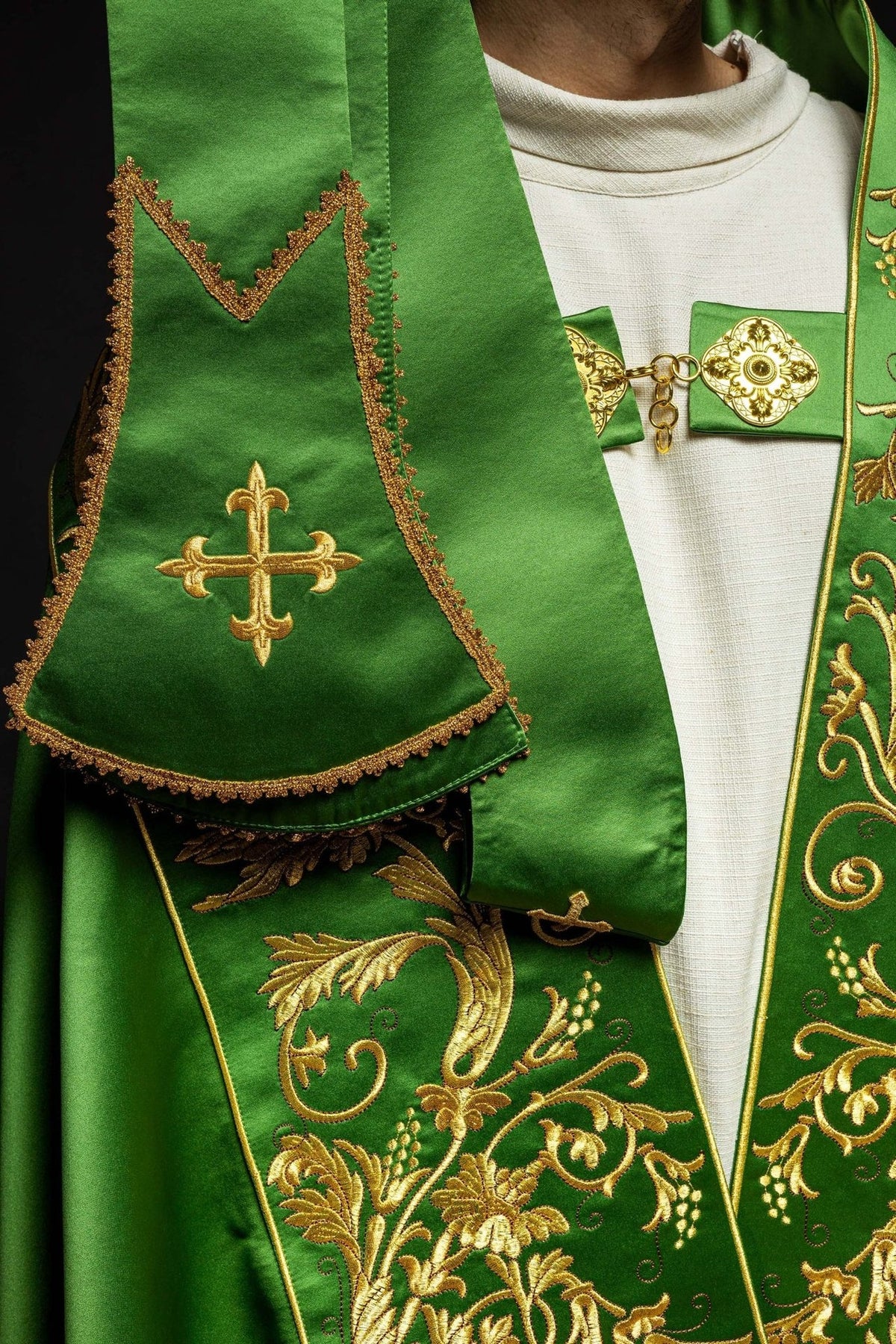 Green satin cope, close-up of embroidered cross detail