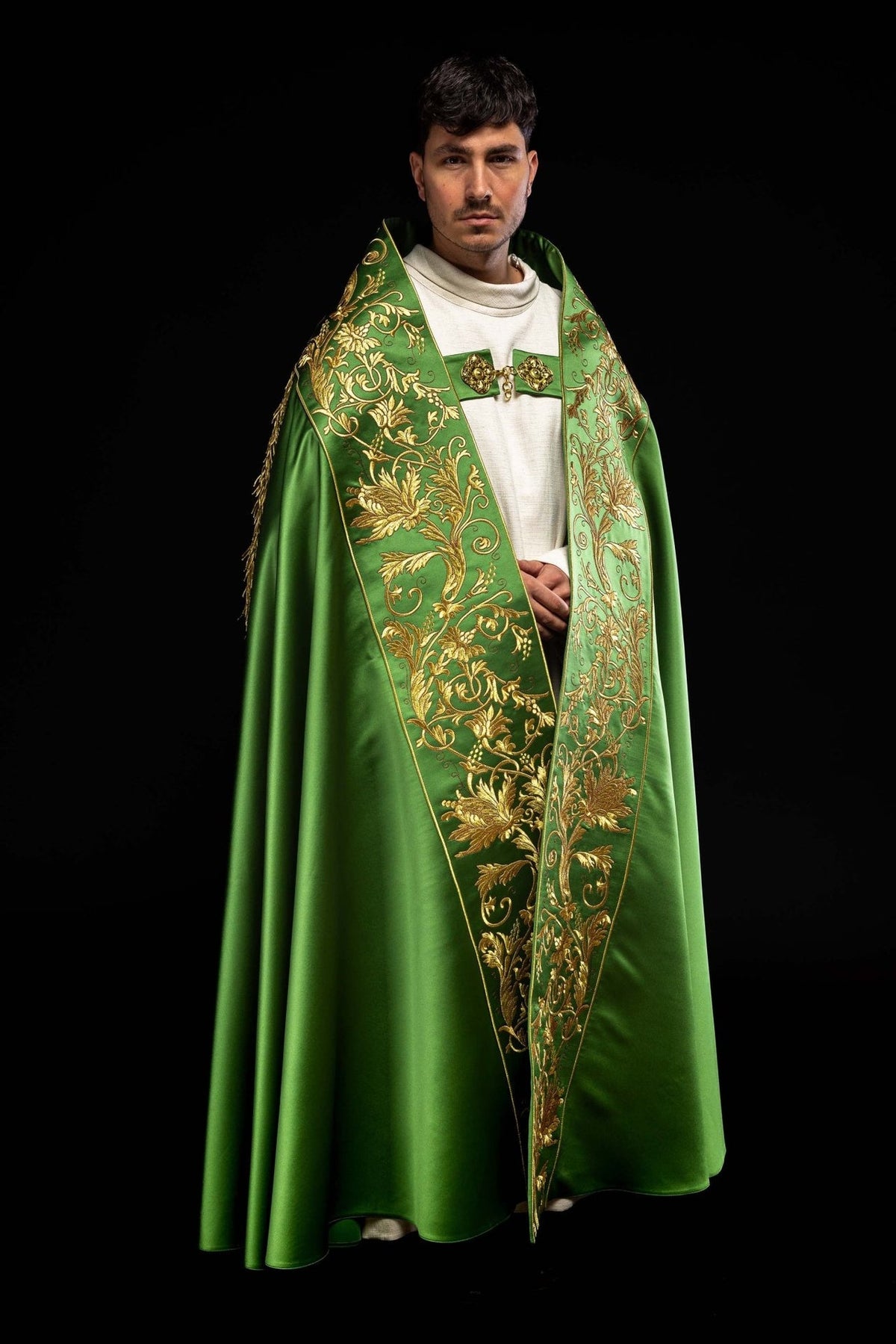 Green satin cope, angled front view with gold floral embroidery