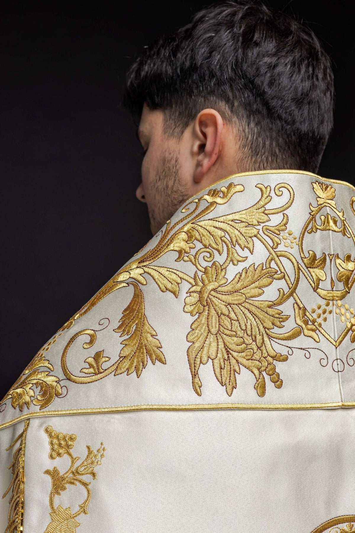 Ecru satin Roman cope, back close-up with ornate gold embroidery and floral motifs