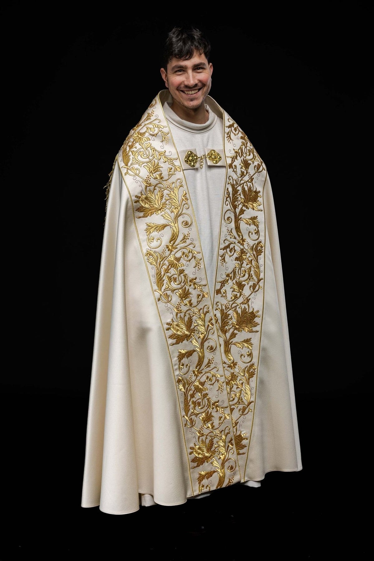 Ecru satin Roman cope, front worn view with ornate gold floral embroidery