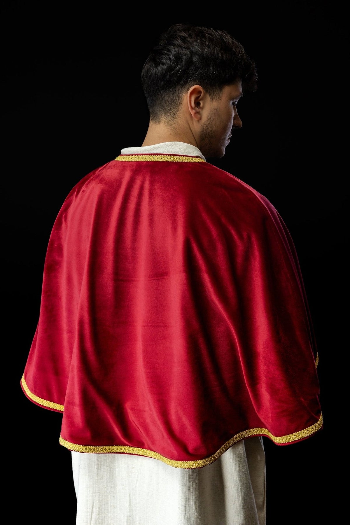 Red velvet altar server cape, close-up of velvet back and gold trim