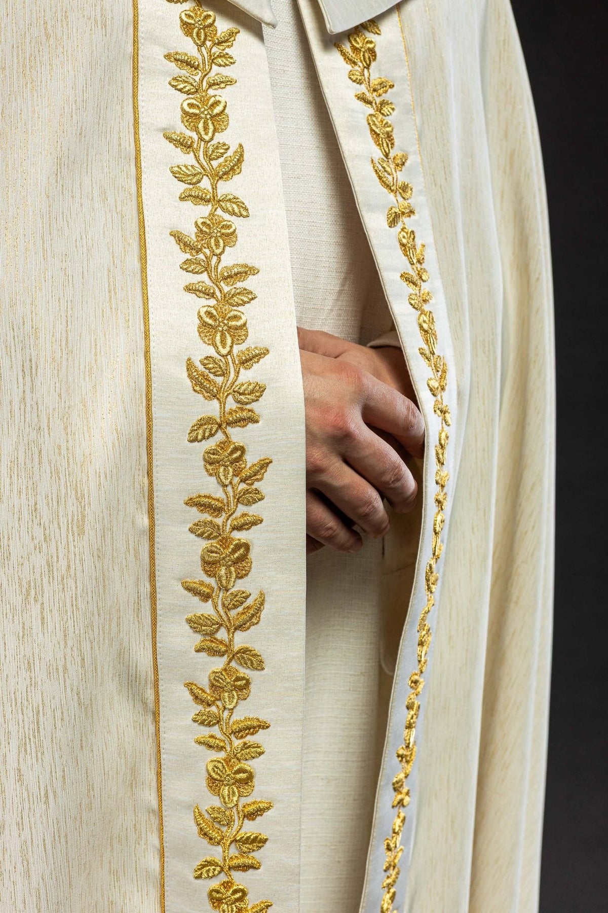 Marian cope close-up showing gold floral embroidery and ornate clasp