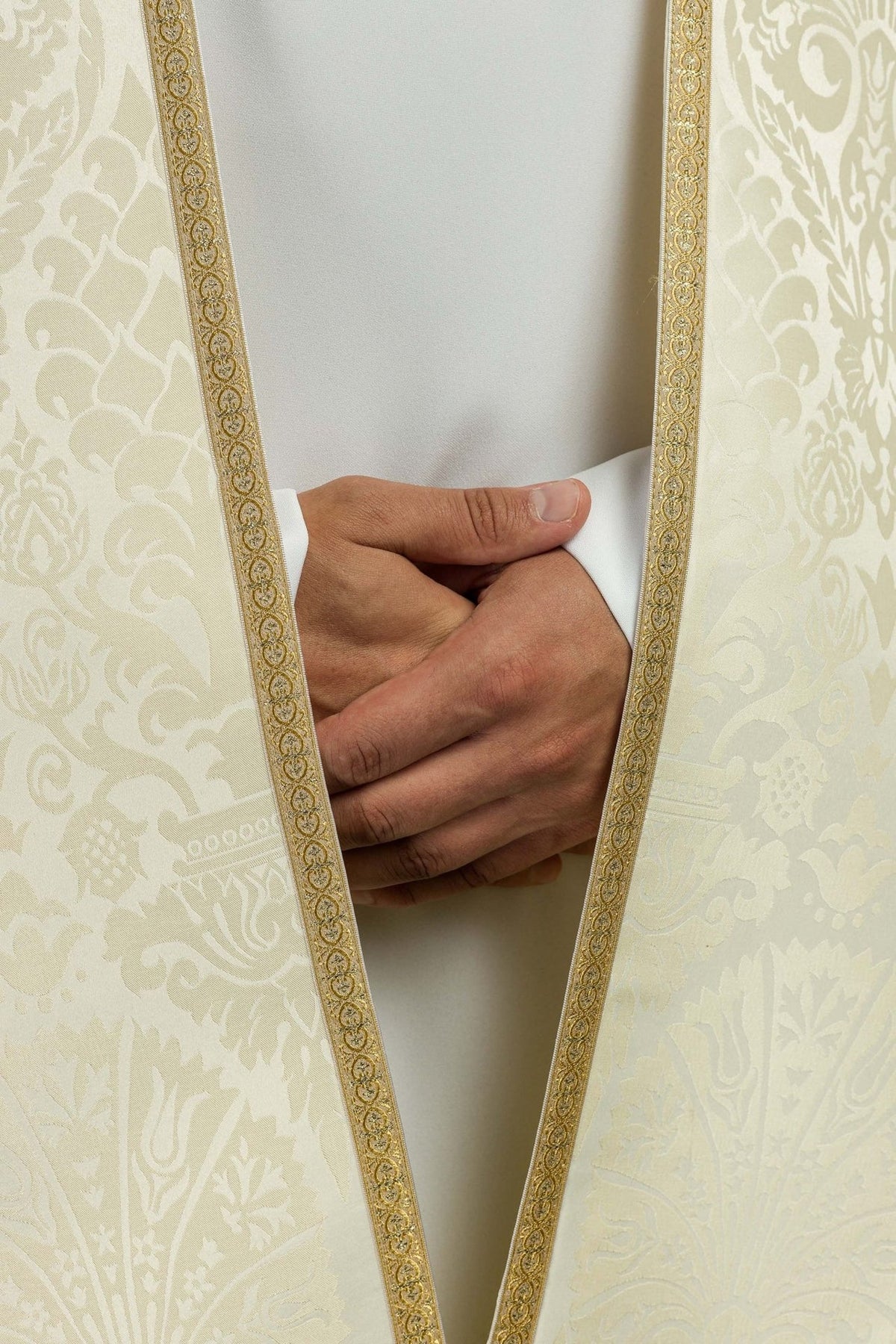 Roman cope front detail showing ecru jacquard and gold-edged opening