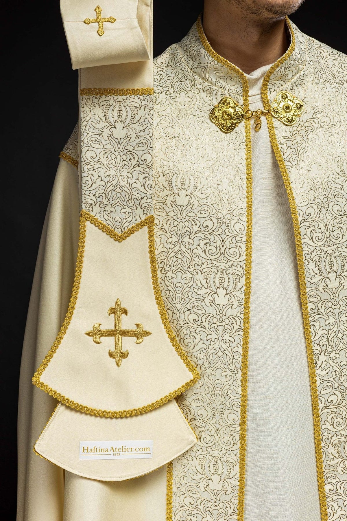 Ecru cope front detail with gold edging, ornate fabric and matching stole