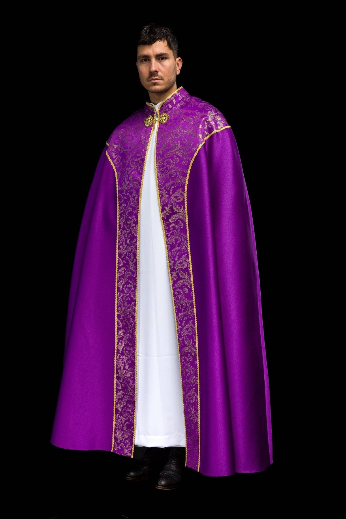 Purple cope angled front view with gold jacquard fabric decoration and trim