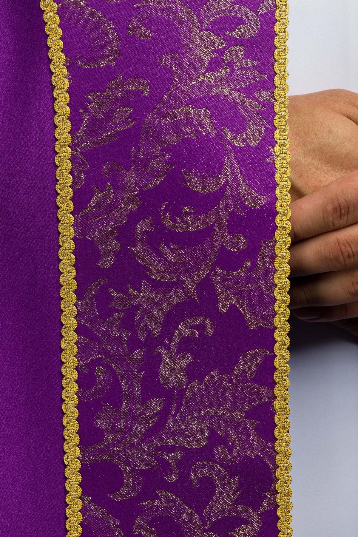 Purple cope front detail of ornate jacquard fabric panels with gold trim