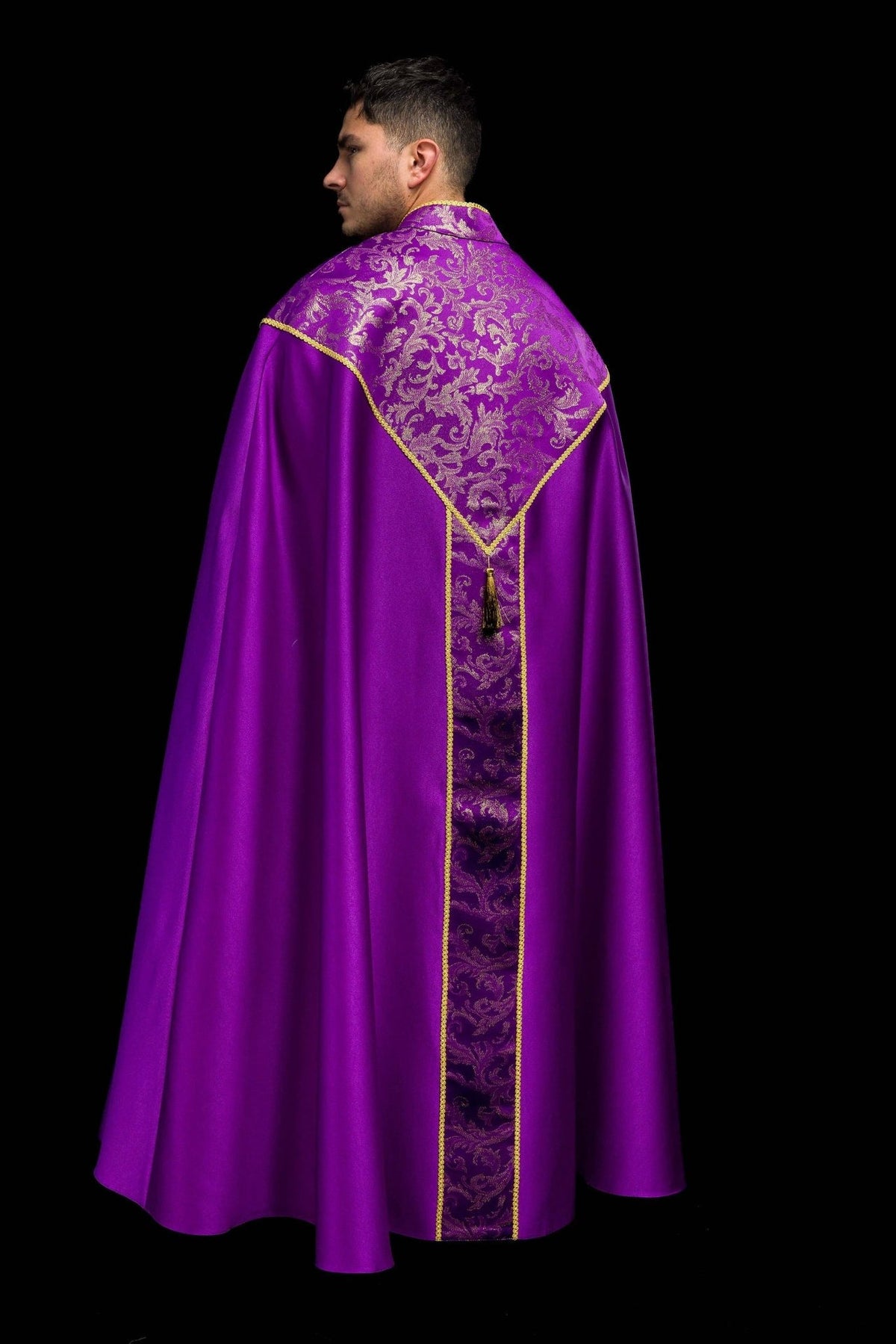 Purple cope back view with central jacquard fabric panel, gold trim and tassel