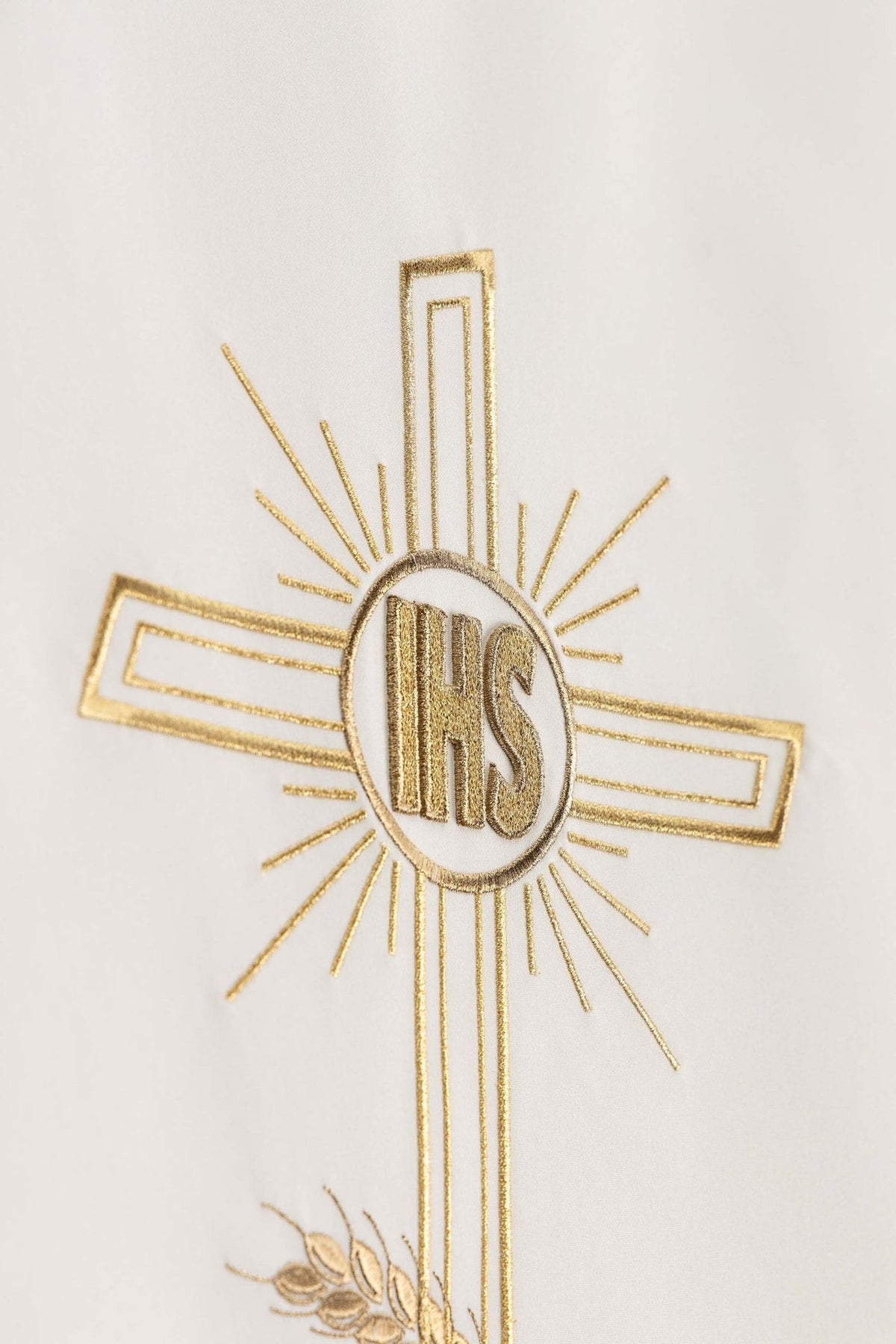 Ecru church lectern cover close-up of gold embroidered cross and IHS monogram