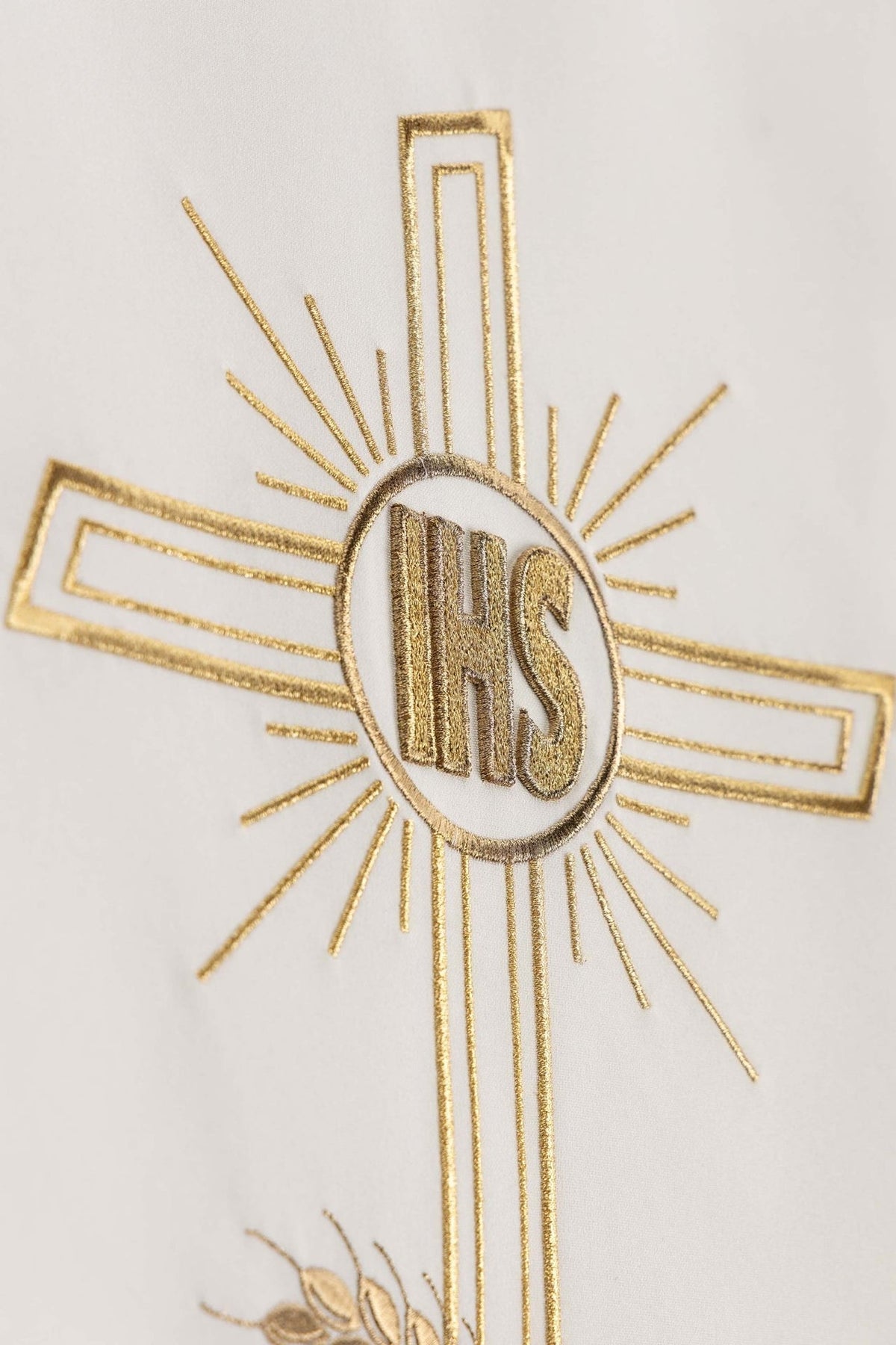 Ecru church lectern cover close-up of gold IHS monogram and radiating cross embroidery