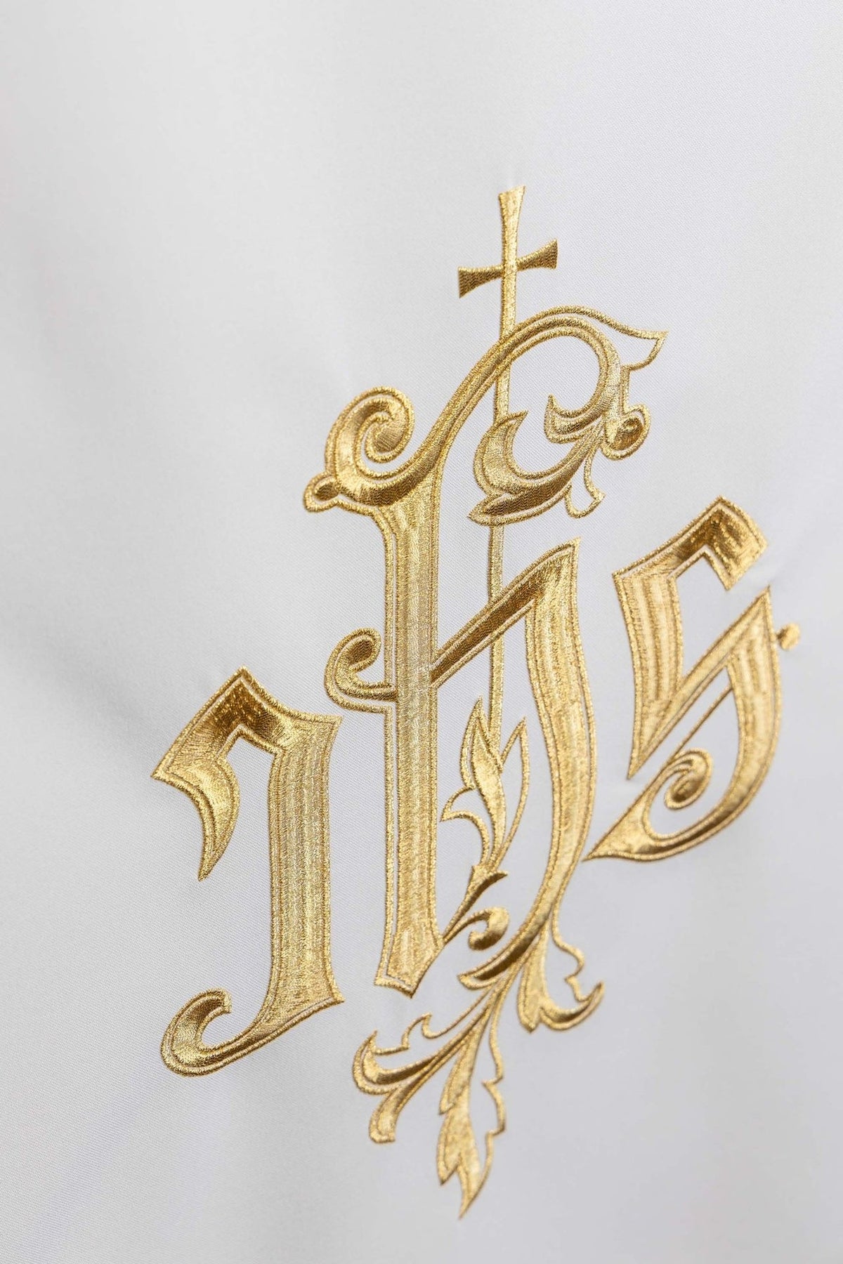 Church lectern cover angled close-up of gold IHS embroidery