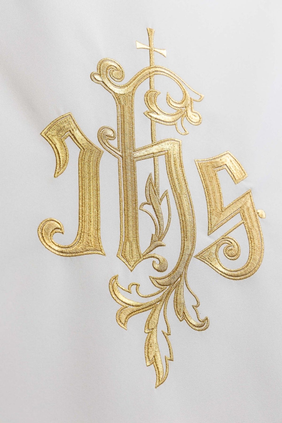 Church lectern cover close-up showing cross and ornate gold embroidery