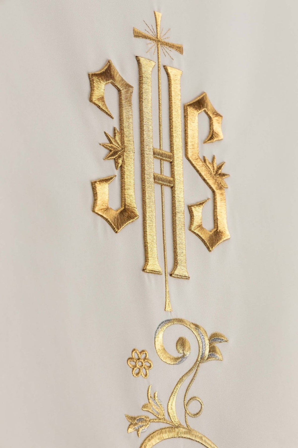 Church lectern cover detail showing IHS monogram and floral embroidery