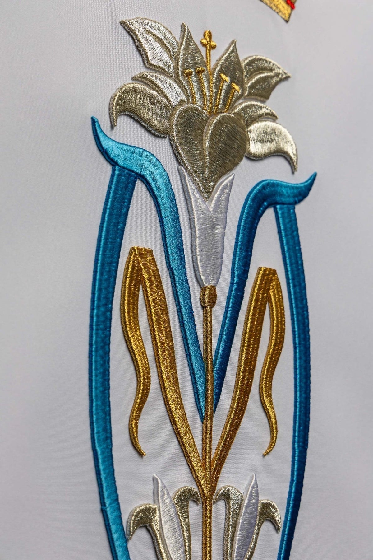 Church lectern cover close-up of the blue and gold lily embroidery