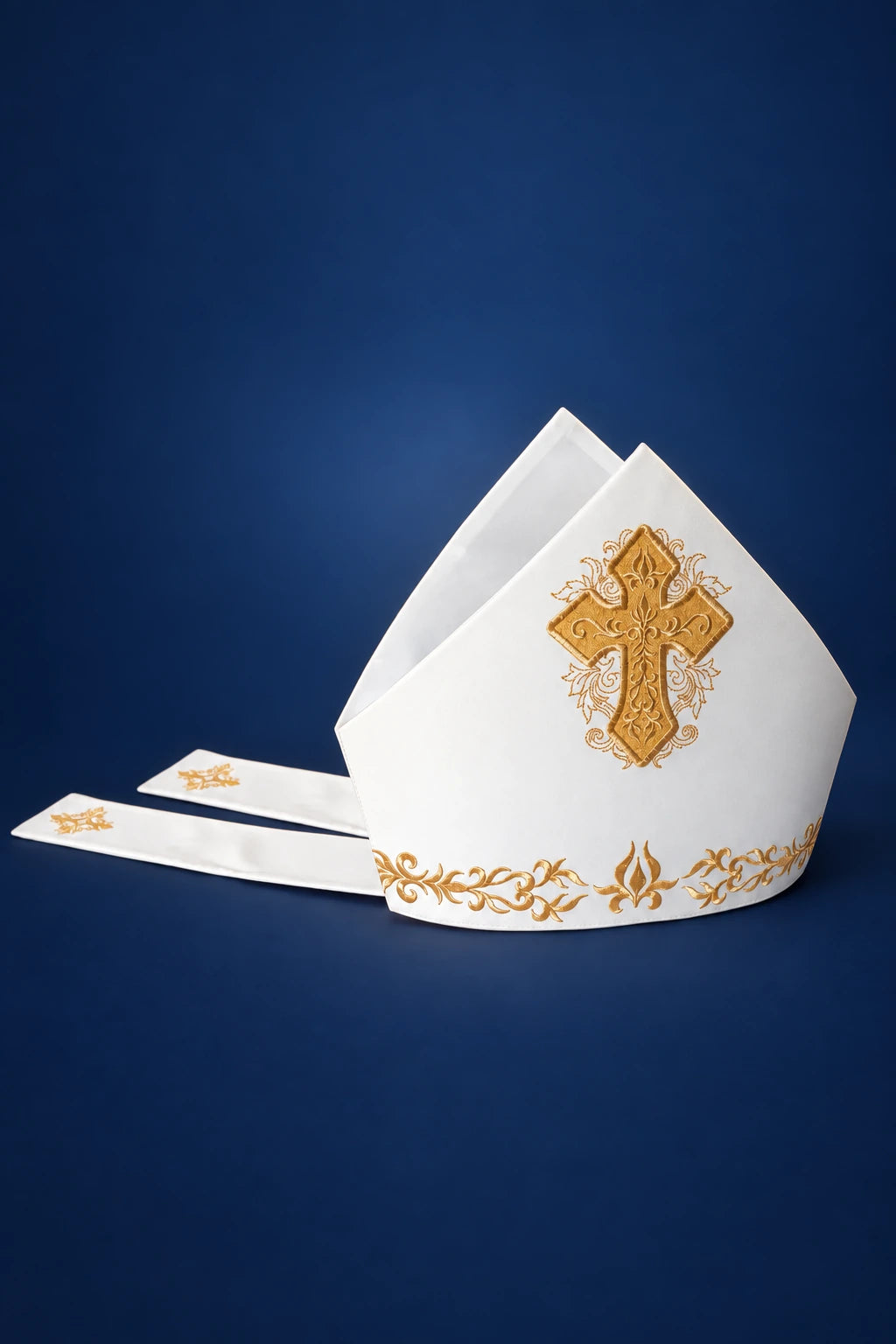 Miter with Rich Embroidery and a Thick Gold Cross, front view in white with gold embroidery