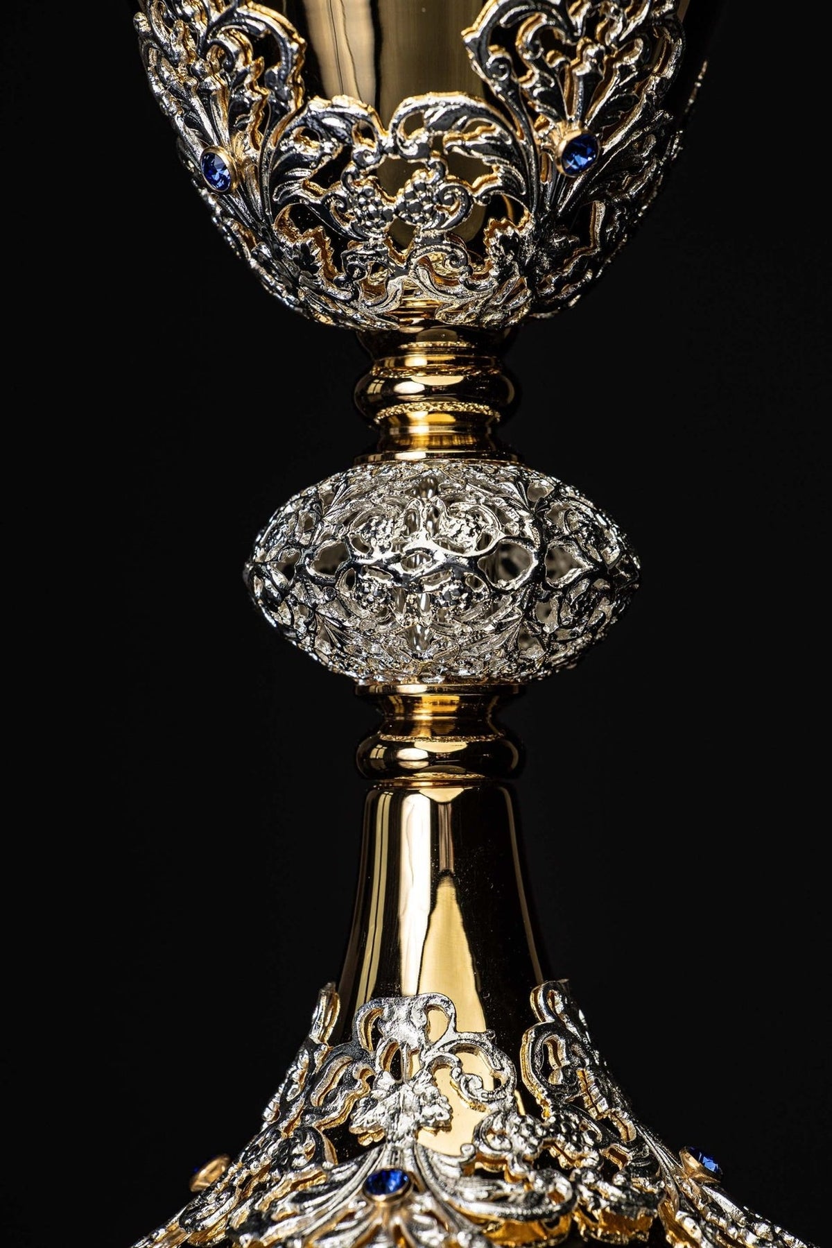 Chalice close-up showing ornate silver-toned bowl decoration and imitation sapphires