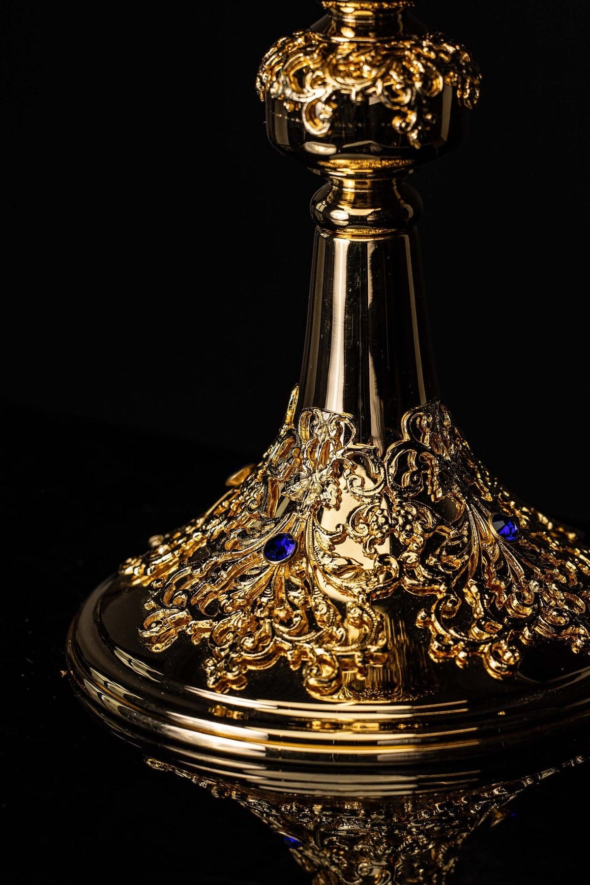 Gold-plated ciborium front detail showing ornate bowl, stem and floral decoration