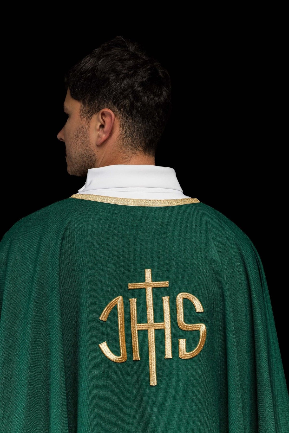 Green chasuble back close-up with gold IHS embroidery and trim