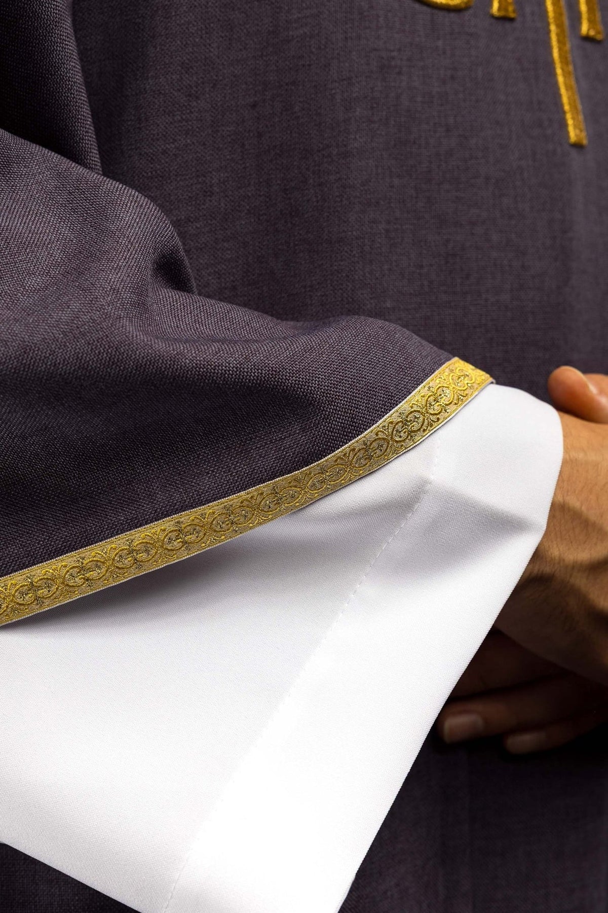 Purple chasuble close-up of gold trim on sleeve