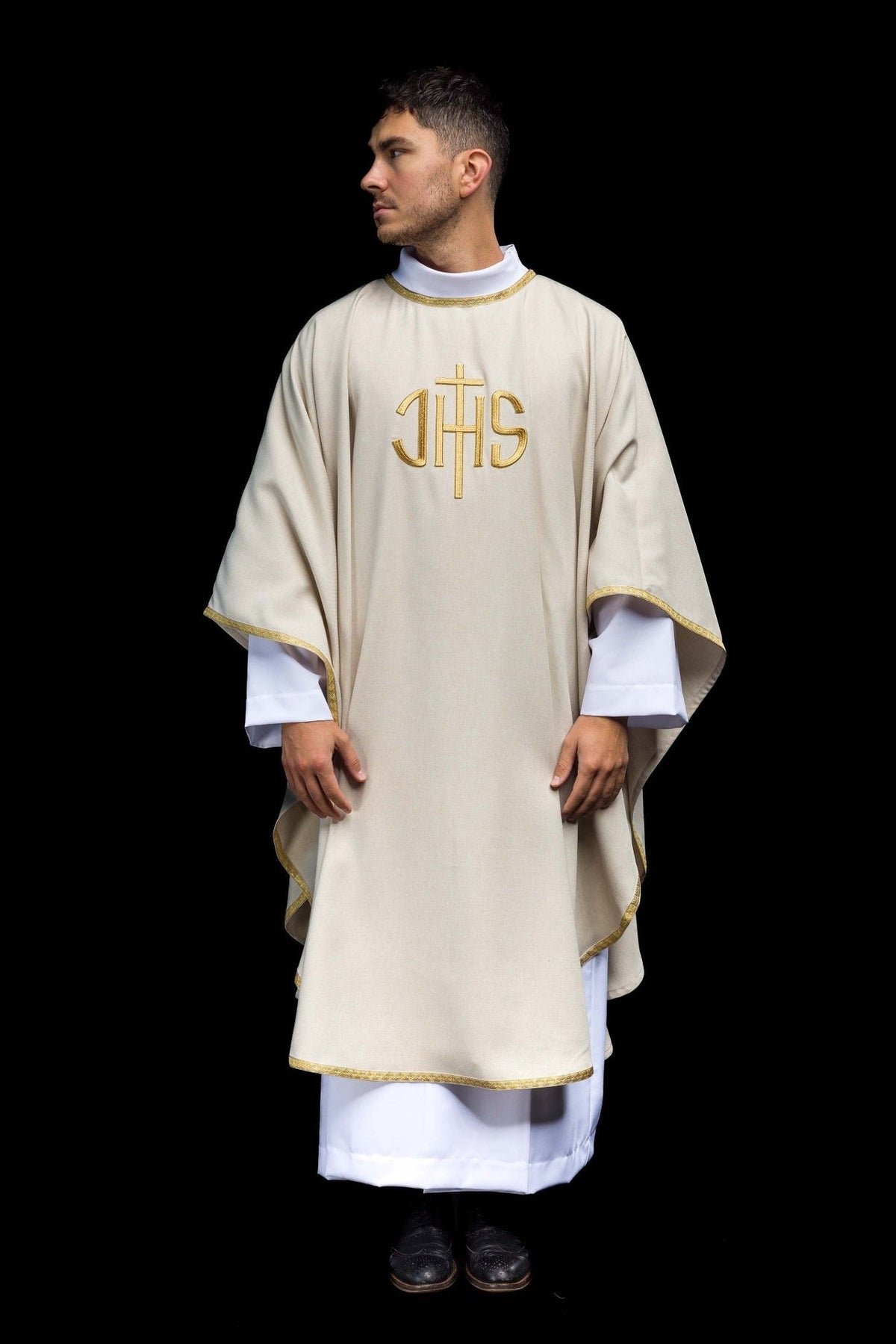 Ecru chasuble front view showing gold trim and IHS embroidery